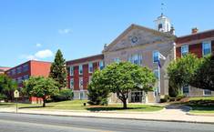 Historic Cranston, Rhode Island civic building under blue summer sky